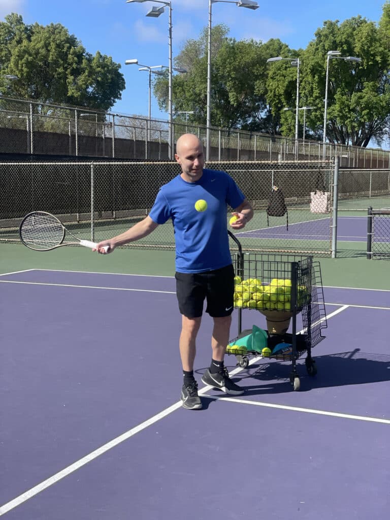 USPTA tennis coach Andrew Toprak on court at El Dorado Park